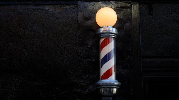 Barbershop-pole-against-black-brick-wall-1024x575.jpg